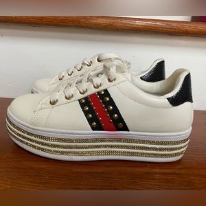 Black, Red and Gold studded Gucci look alike tennis shoes. Purchased in Vegas